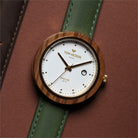 Tom Hessin Revolution Gold watch with green leather strap and gold buckle - lifestyle close up
