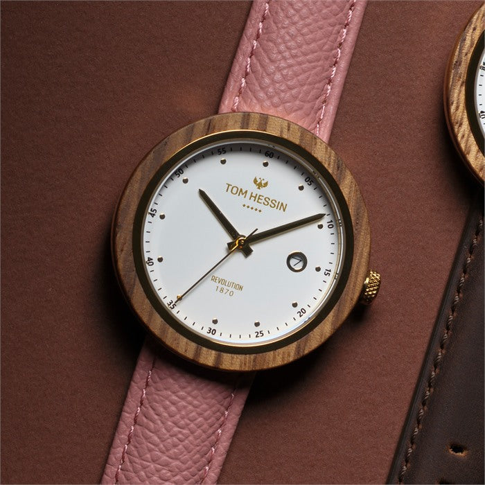 Tom Hessin Revolution Gold watch with pink Epsom leather strap and gold buckle - lifestyle close up