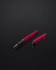 Tom Hessin Magnetic Series Poppy Red fountain pen and cap turning through 360 degrees on black glass