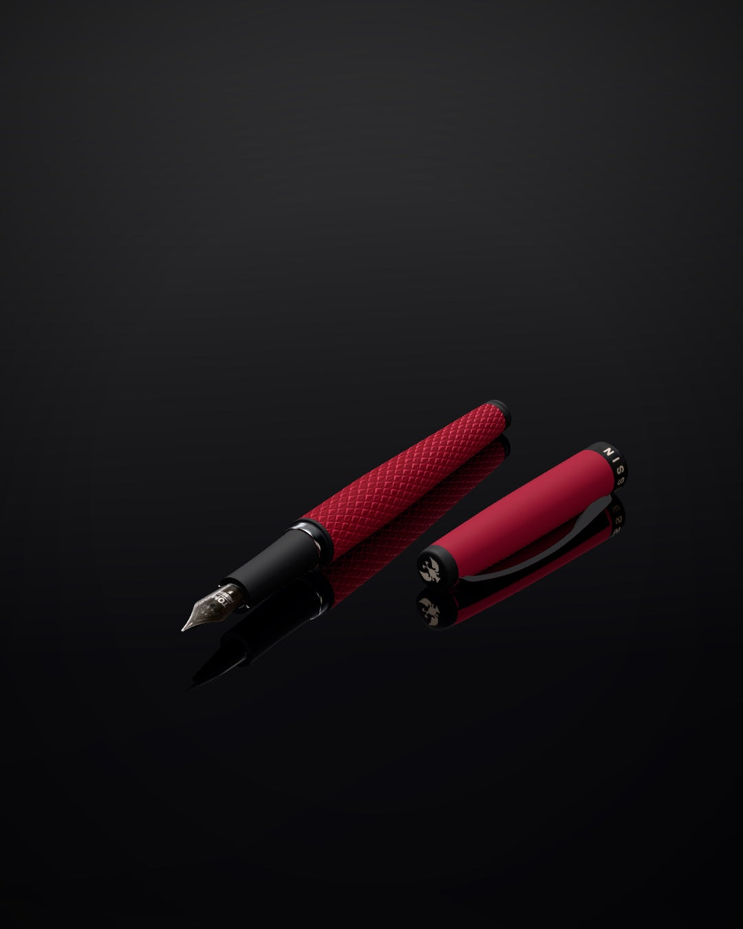 Tom Hessin Magnetic Series Poppy Red fountain pen with its cap, on black glass